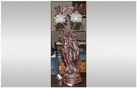 Large Resin Figural Table Lamp in the classical style. Frosted two branch glass shades. 30 inches