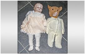Composition Doll with closing eyes, moveable limbs and soft body. Together with well loved soft