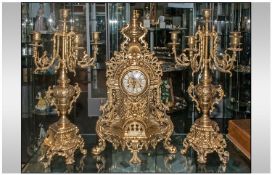Continental Gilded Cast Brass Rocooco Style Three Piece Garniture Clock Set. A pair of elaborate