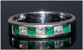 18ct Gold Half Eternity Ring Set With Alternating Calibre Cut Emeralds And Princess Cut Diamonds,