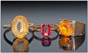 Three 9ct Gold Dress Rings Set With Citrine And Ruby Coloured Faceted Stones, 2 Stamped 9ct, The