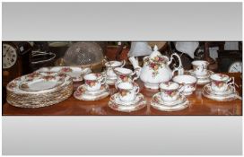 A Selection of Royal Albert `Country Garden` Bone China. There are 8 dinner plates, 2 sandwich