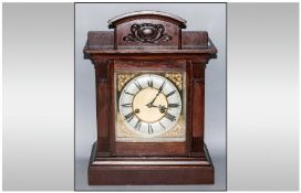 German Square Brass Dial 8 Day Mantle Clock On Gong, in stained oak case. Circa 1900. With a shaped