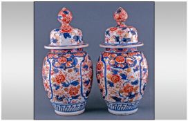 Pair Of Japanese Lidded Imari Vases Of Baluster Shape the bodies decorated in the traditional Imari