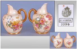Royal Worcester Hand Painted Pair Of Blush Ivory Jugs, decorated with images of spring flowers with