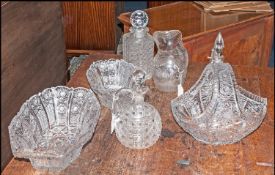 Seven Pieces Of Cut Glass Comprising three bowls, three decanters & a water jug.