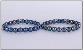 Pair of Peacock Fresh Water Pearl Bracelets, each matching bracelet comprising a row of peacock