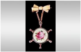 Gold & Silver Gilt Yellow Enamel Pendant/Brooch in the form of a ships wheel held by a bow tie. 2.