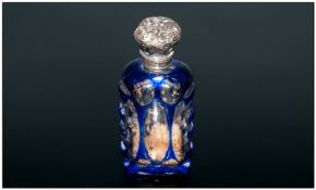 A Blue Overlaid Glass Perfume Bottle  with a silvered metal embossed top. Unmarked. c 1860. 3¼