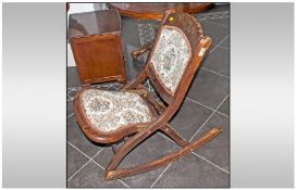 Oak Framed Rocking Chair, with brass inserts. Upholstered seat and back.