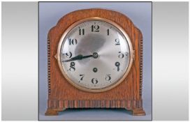 WITHDRAWN / 1930`s Oak Cased Dome Mantle Clock with a round steel dial and three winding apertures.