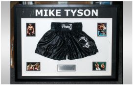 Mike Tyson Signed, Framed Memorabilia. Comprising off a Pair of Mike Tyson Black Shorts, and