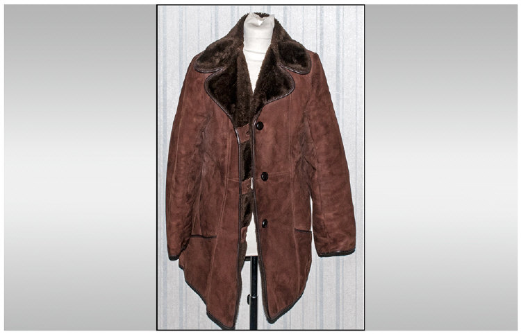 Ladies Suede Coat,  Acrylic lined. button fastening & slit pockets. Approximate size 12-14