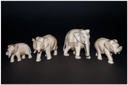 A Pair Of Small Well Carved Ivory Figures, 4 in total. A family of Indian Elephants. Circa 1900-