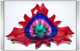 Murano Style Glass Centre Piece with wavy rim and of colourful design. 15 inches in diameter.