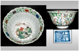 Chinese Kang-Hsi Bowl with shaped borders enamelled in Famille Verta with eight panels of birds &