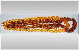 Three Various Amber Style Necklaces, one with round, transparent yellow beads; 24 inches long, the