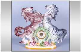 Ceramic Figural Mercedes Mantle Clock, Either side of clock with rearing horses. Roman numerals.