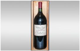 Bottle of `1990 Chateau Cissac, Haut-Medoc, France`   Red Wine in wood case.