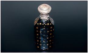 An Unusual French Midnight Blue Faceted Body Perfume Bottle, gilded to the exterior with moon and