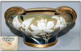 Amphora Art Nouveau Bowl, the exterior with hand enamelled white lilies, with raised gilt
