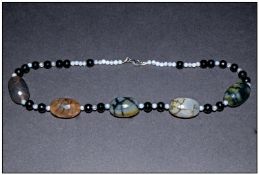 Crackled Agate and Black Onyx Necklace, comprising large faceted, oval crackled agate beads