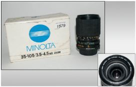 A Minolta Camera Lens In Original Box. 35-105/3.5-4.5 MD Zoom.