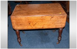 A Victorian Mahogany Drop Leaf Sutherland Type Breakfast Table on turned legs with one single