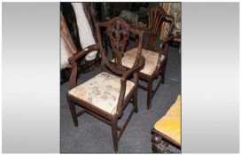 Two Mahogany Georgian Style Shield Back Armchairs Both on square legs with cross stretchers.