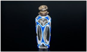 An Unusual Miniature Ladies Pocket Perfume Bottle with a cut and faceted blue and white over laid