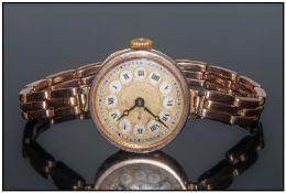 Ladies - Art Deco 9ct Gold Circular Cased Wrist Watch. Fitted To a  9ct Gold Expanding Bracelet.