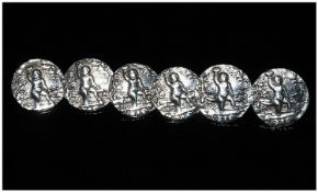 Edwardian Silver Set Of Six Buttons each button decorated with raised images of naked figures.