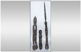 Three African Carved Figures, 2 depicting old men walking and one bird ebony carved totem.