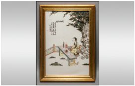 Japanese 20th Century Framed Ceramic/Tile Wall Plaque depicting a young Japanese woman seated on a