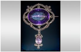 Edwardian Silver Brooch/Pendant set with a large faceted amethyst of excellent colour, in turn