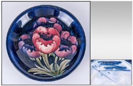 William Moorcroft Shallow Bowl `Big Poppy` Pattern, Circa 1920, 7.25`` in diameter. Overpainting to