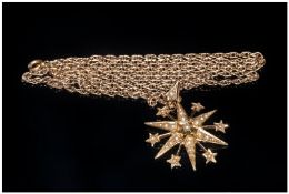 Edwardian 15ct Gold & Seed Pearl Starburst Pendant, fitted to long 9ct gold chain. Marked 625.