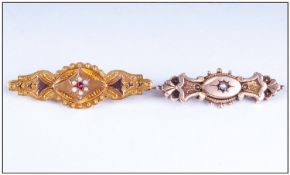 Two Late 19thC Early 20thC Pressed Brooches One Set With A Central Ruby And Pearls (Stamped AB 9ct),