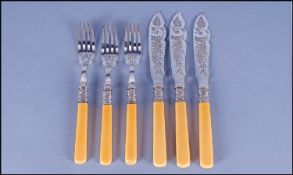 Set Of Six Fish Knives and Forks, with banding and ivory knives.