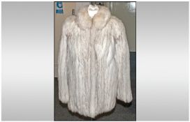 Ladies Blue Fox Fur Jacket, fully lined. Size 14. Discreet suede strips between fur skins. Slit