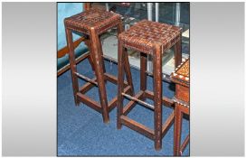 Two Wooden Stools with leather weaved top.