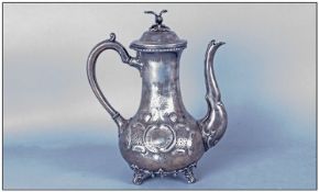 Pewter Coffee Pot with bird finial to hinged lid. Four claw feet & decoration to front & back. 12"