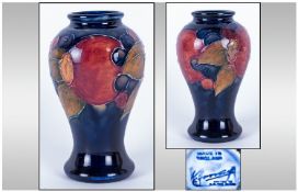 William Moorcroft Small Signed Shaped Vase. Pomegranate and Berries Pattern.  Height 4 Inches.