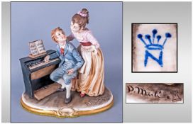 Capo-Di-Monte Early & Signed Figure 'Musical Evening' a young couple at a piano. Signed Bruno Merli.