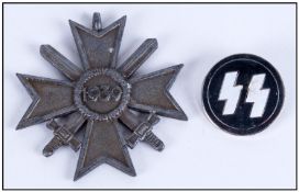 WW2 German War Merit Cross with swords (no ribbon) & 35 party badges.