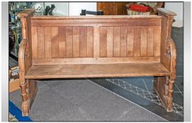 Gothic Style Oak Church Pew with shaped carved sides with columns, with a panelled back. Circa 1900.