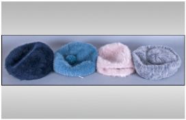 A Collection of three Kangol and one Debenhams winter berret hats, various colours all size small.