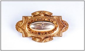 Late 19th Early 20thC Pressed Brooch Of Shaped Form Set With A Central Diamond Chip, Embossed Bead