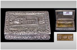 A George IV Very Fine Silver Rectangular Castle Top Snuff Box the hinge lid decorated in relief with