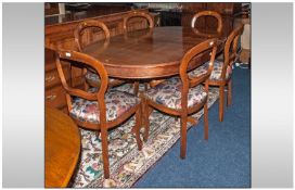 A Set Of Six Balloon Back Dining Chairs with a leaf extending dining table, 5ftx3ft 8". Late 20th